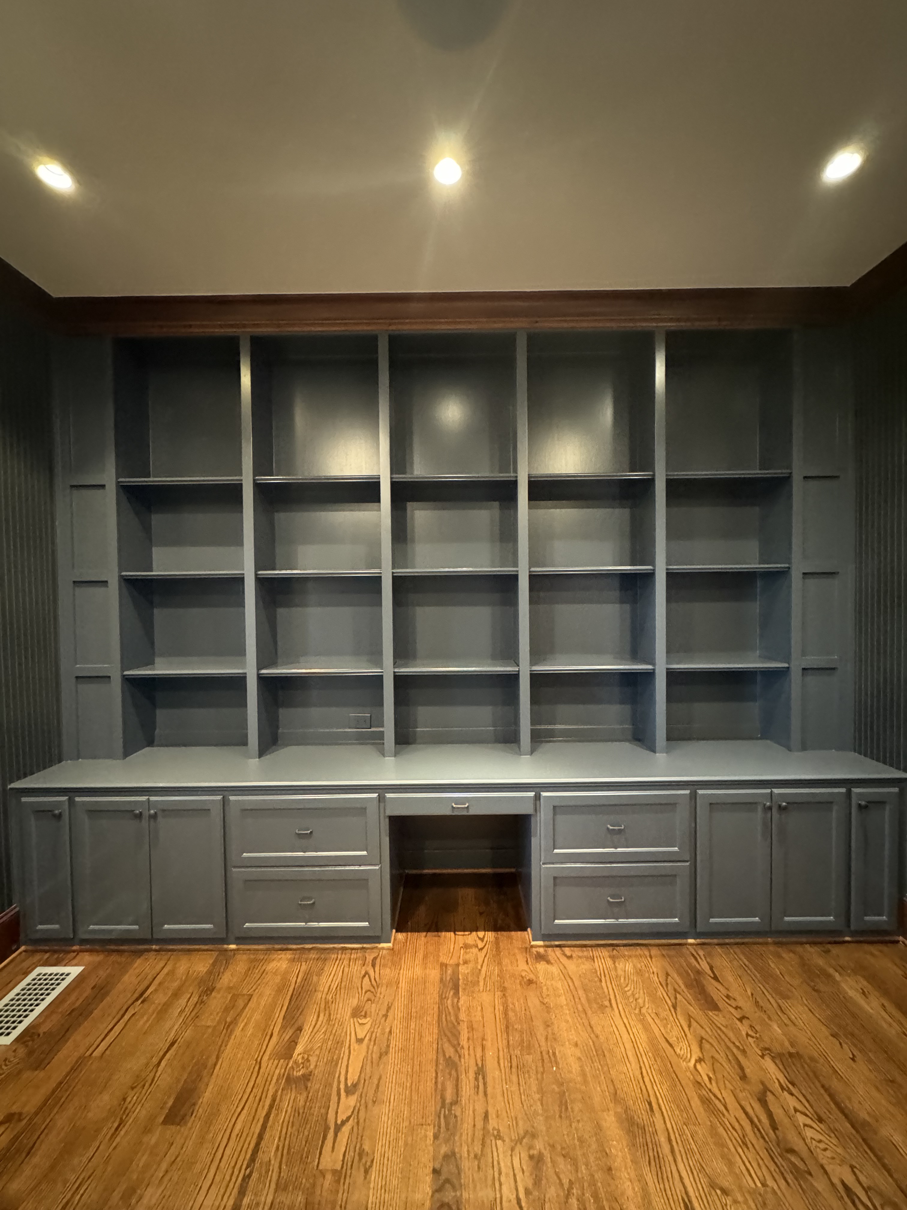 Built-in cabinets after painting — slate blue finish