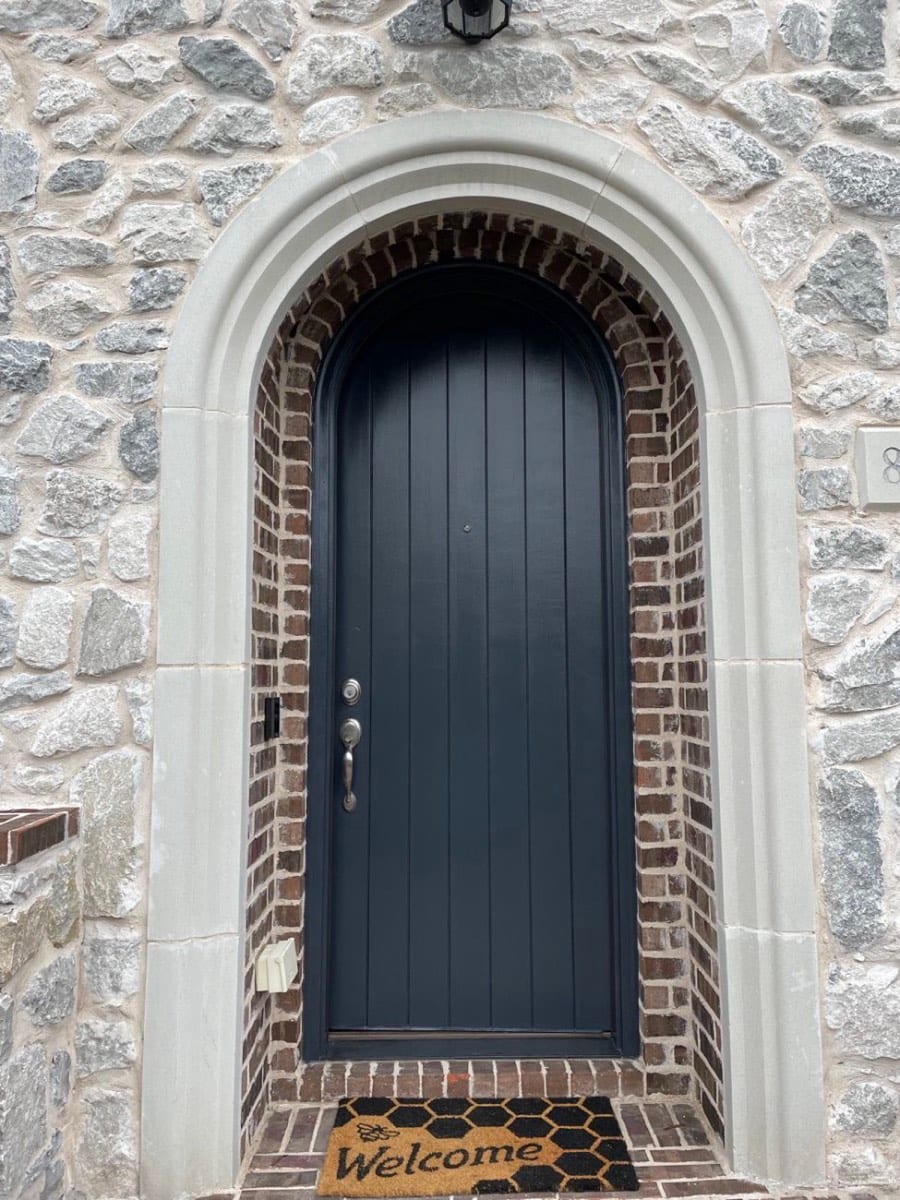Arched front door refinished by Patch Plus Paint