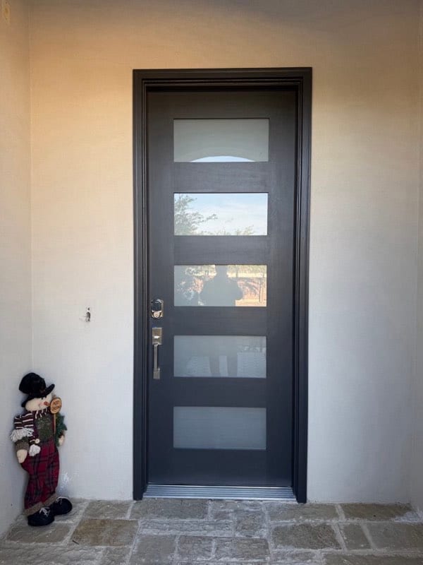 The same front door refinished in dark charcoal