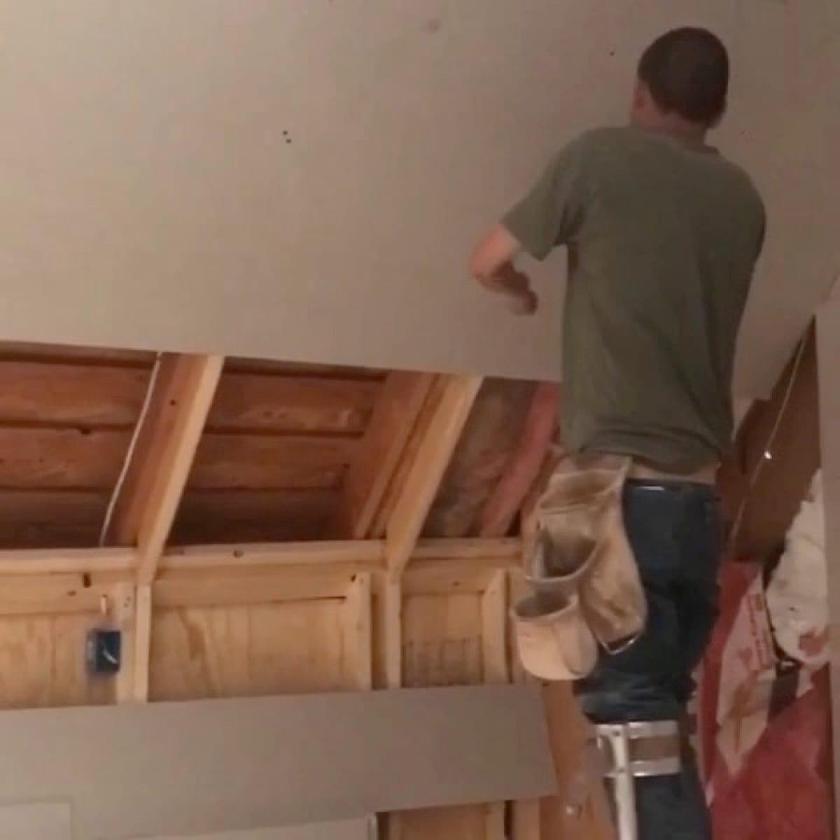 Patch Plus Paint hanging new drywall on an open ceiling
