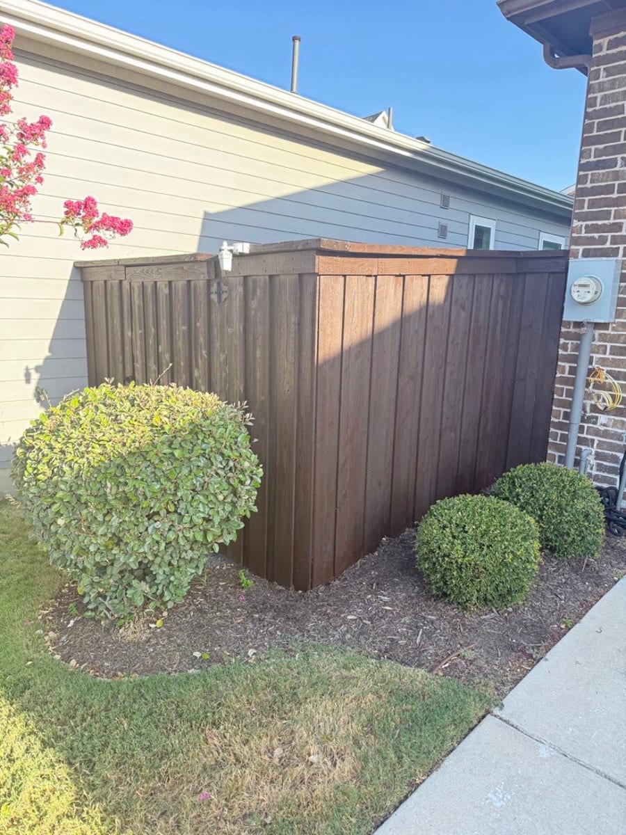 Wooden fence freshly stained by Patch Plus Paint