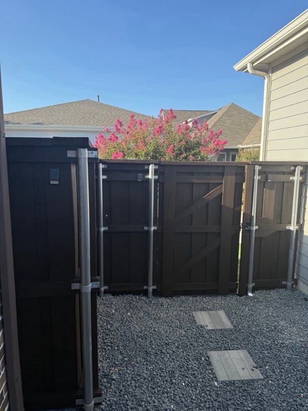 Fence and gate after staining in a dark finish