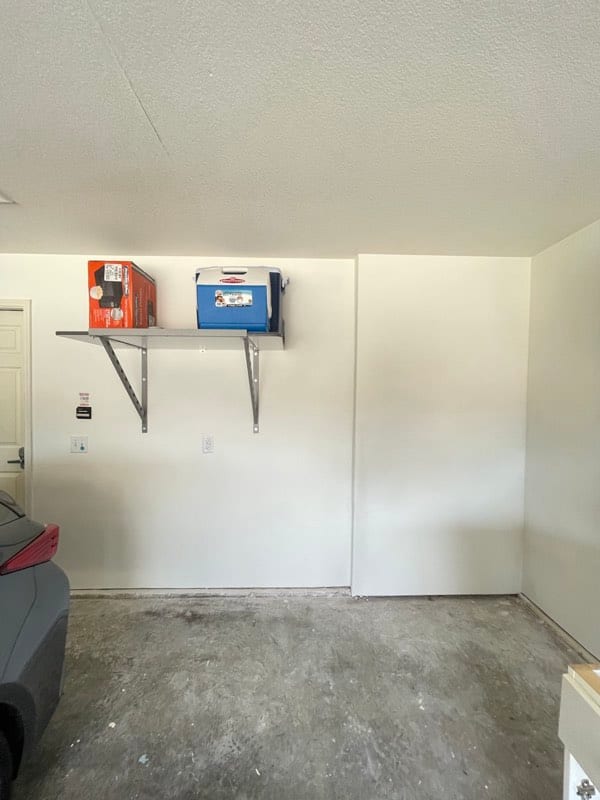 The same garage wall rebuilt, textured and painted