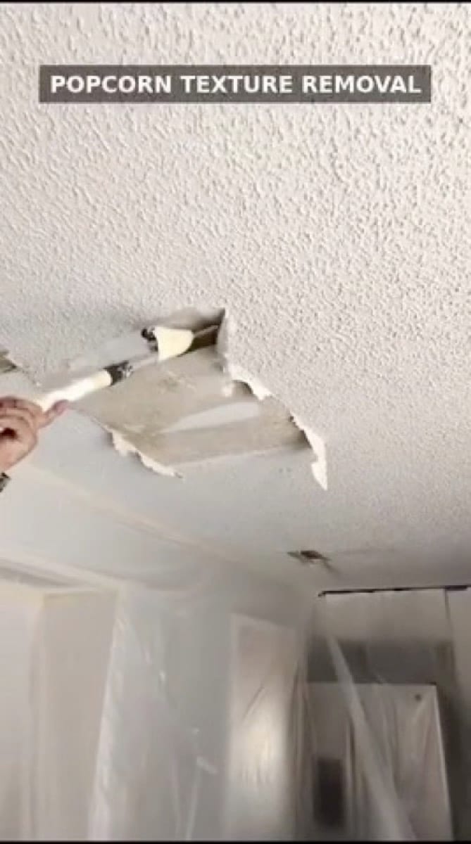 Popcorn texture being scraped from a ceiling by Patch Plus Paint