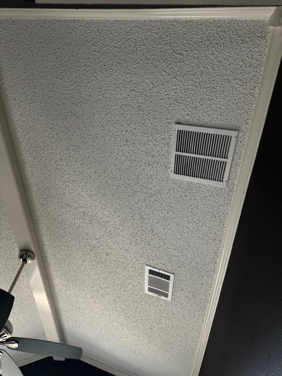 Finished popcorn texture ceiling with vents reinstalled